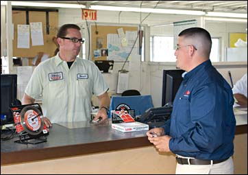 MK Diamond employee speaking to rental counter staff.